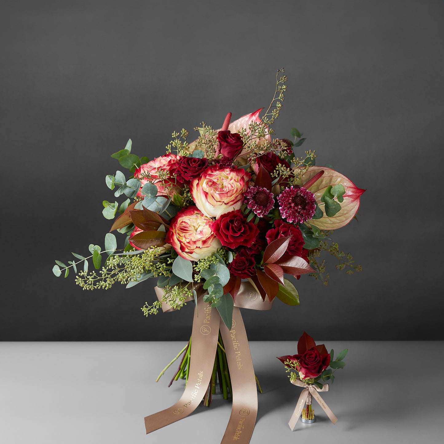 burgundy bridal bouquet with groom boutonniere