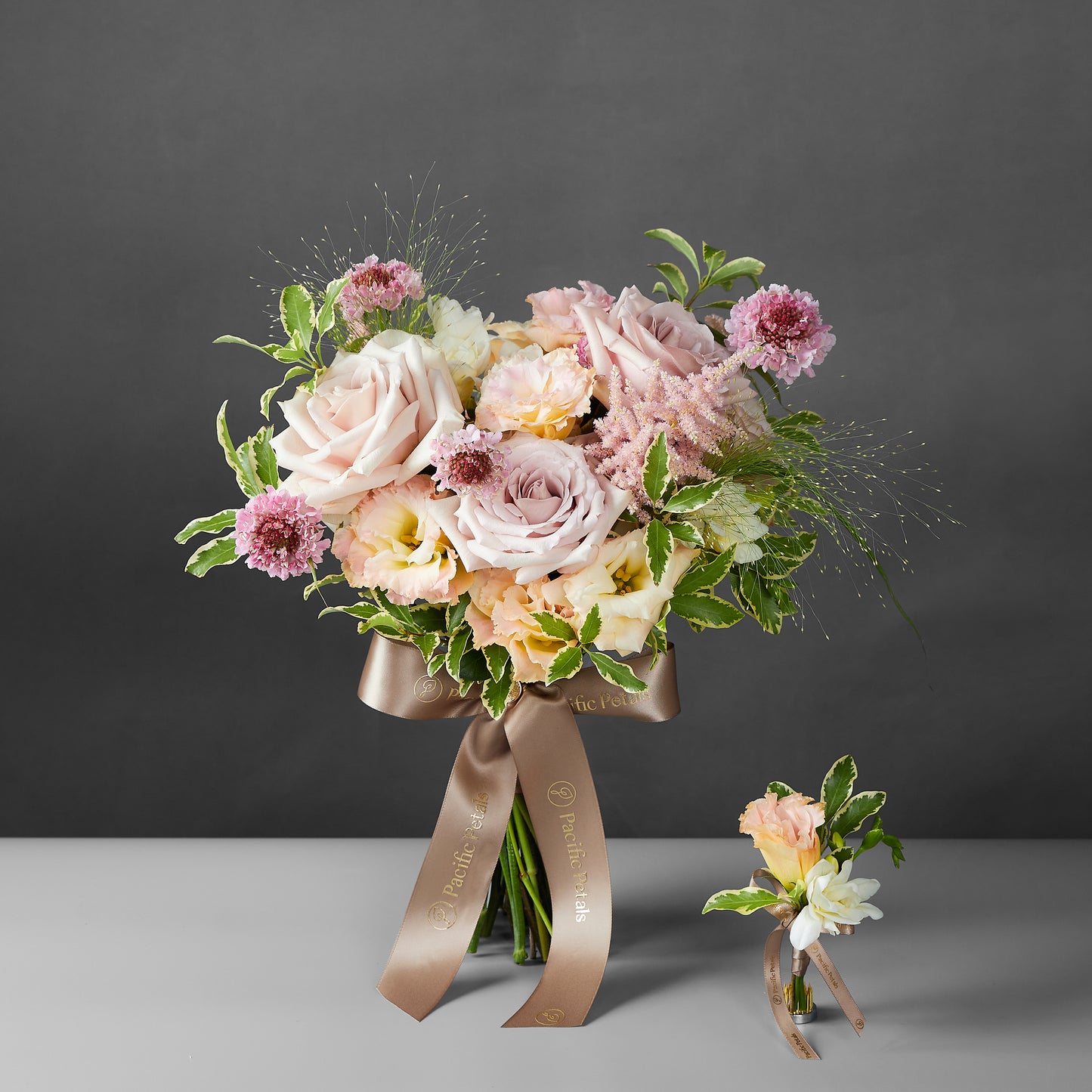 pink and champagn bridal bouquet with groom boutonniere