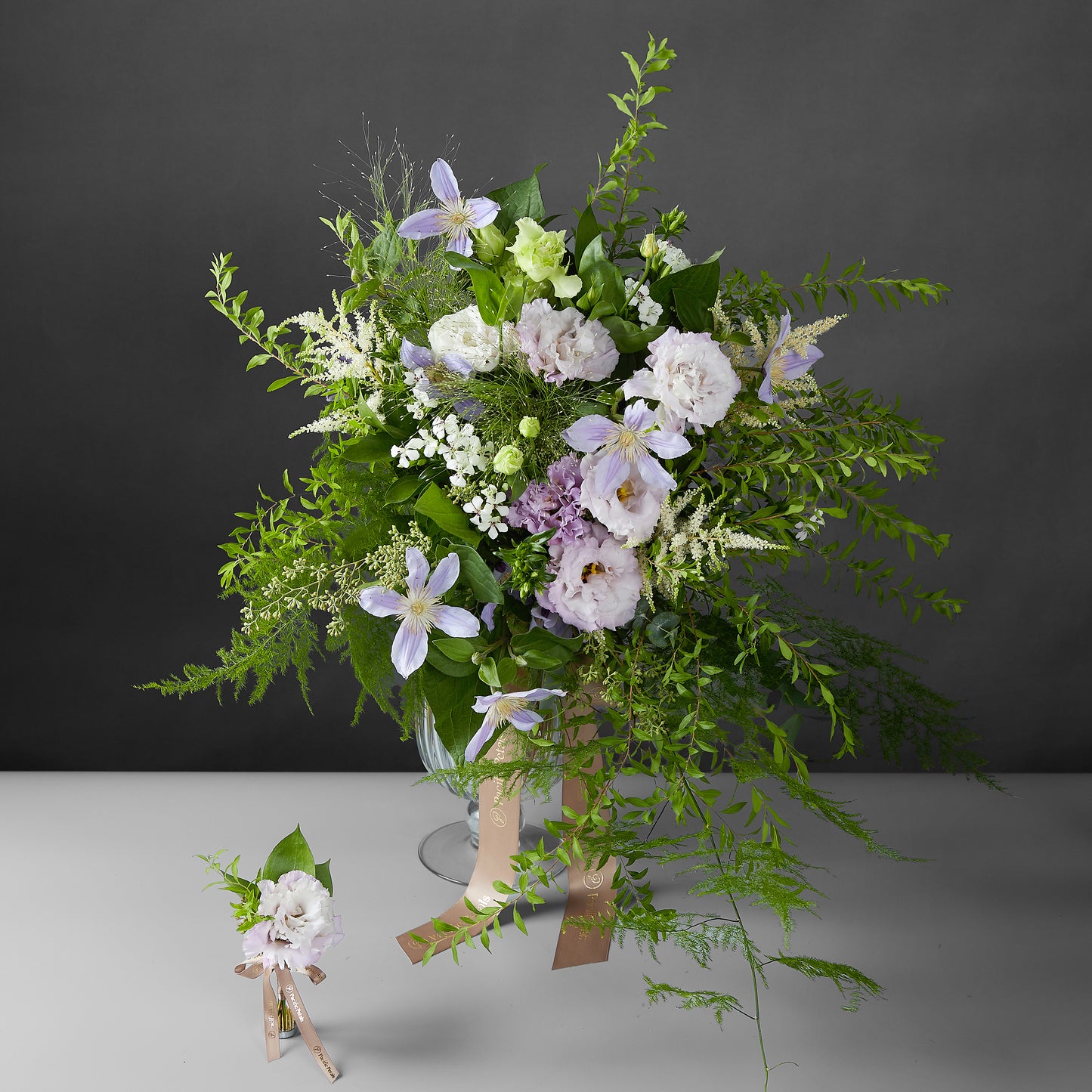 green and purple cascading bridal bouquet with groom boutonniere