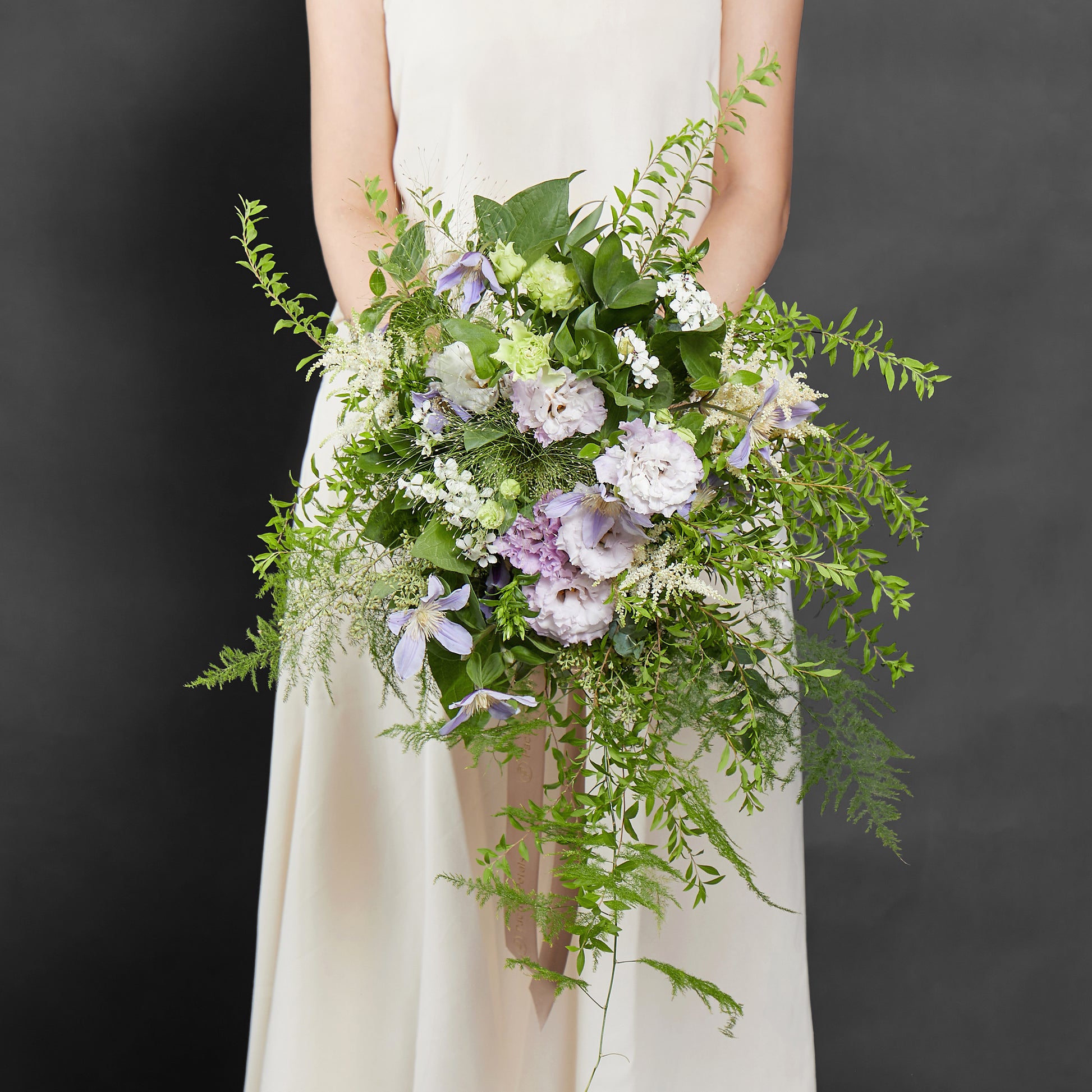 green and purple cascading bridal bouquet