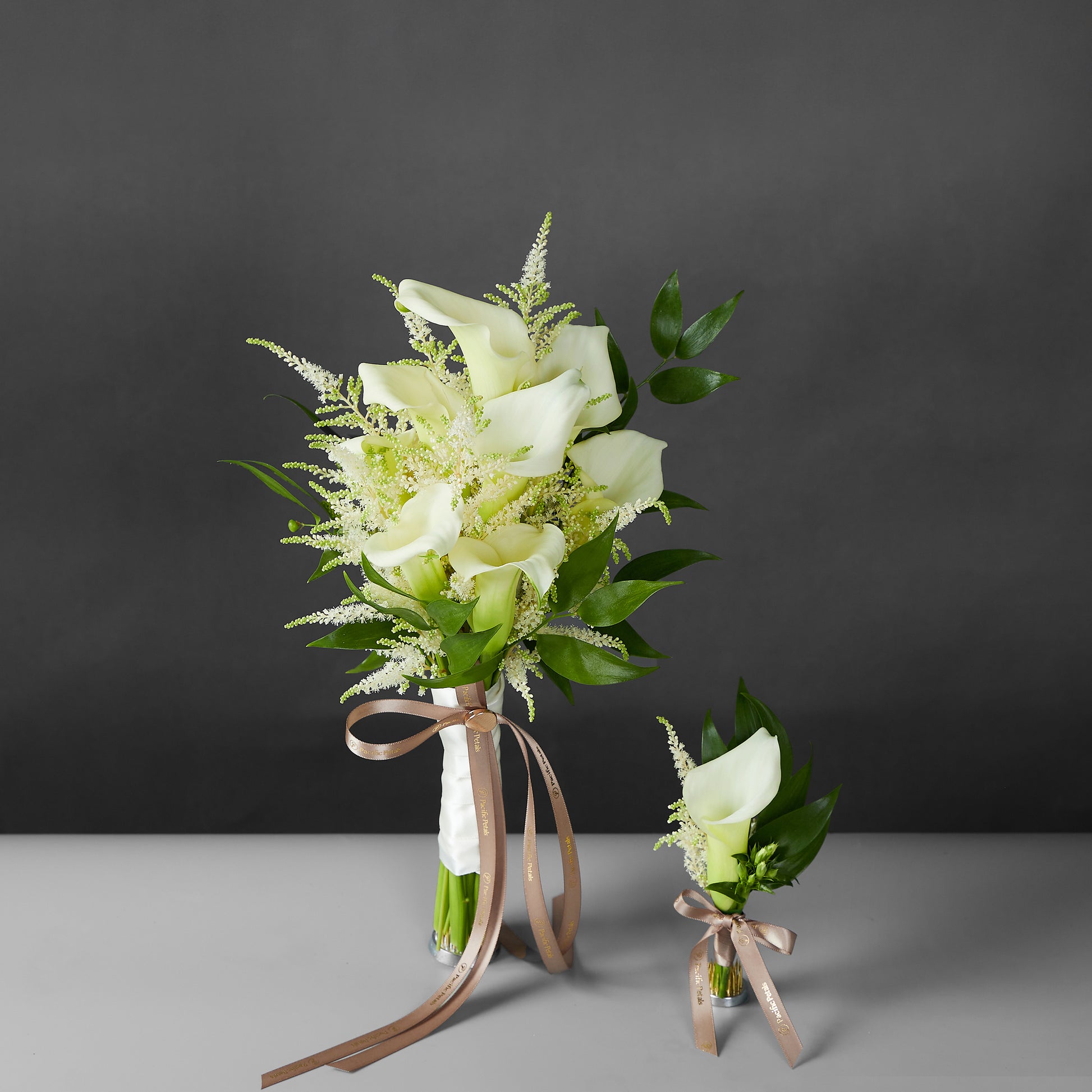 white calla lily and astilbe bridal bouquet with groom boutonniere
