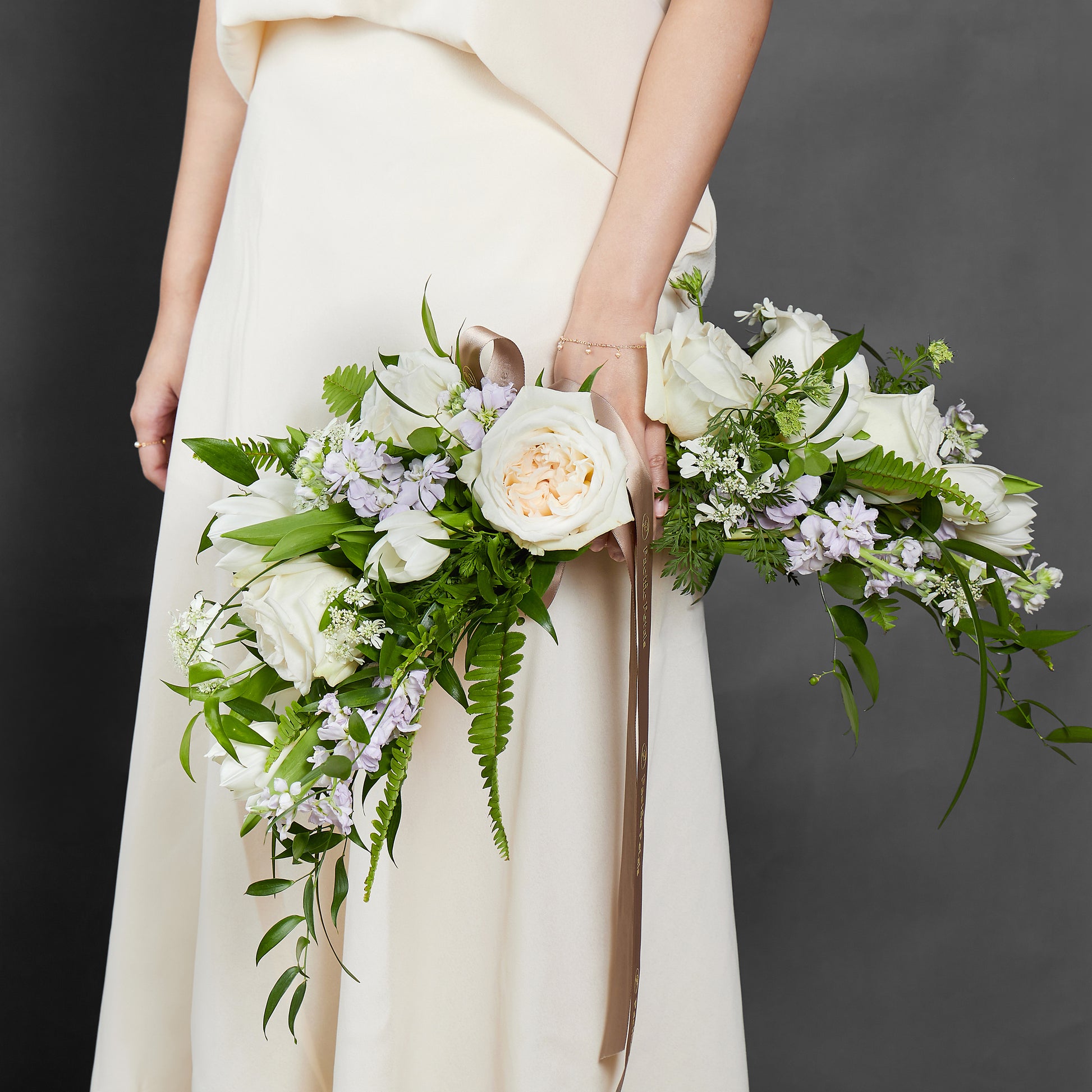 white arrow shaped arm bridal bouquet